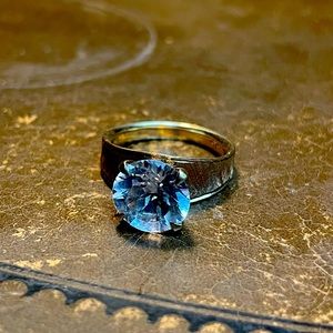 Vintage gold ring with large, pale blue stone